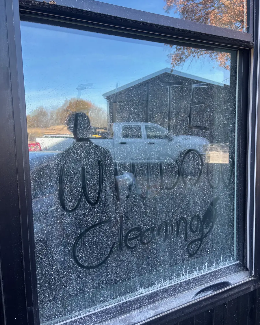 Window so dirty someone wrote window cleaning in the dust