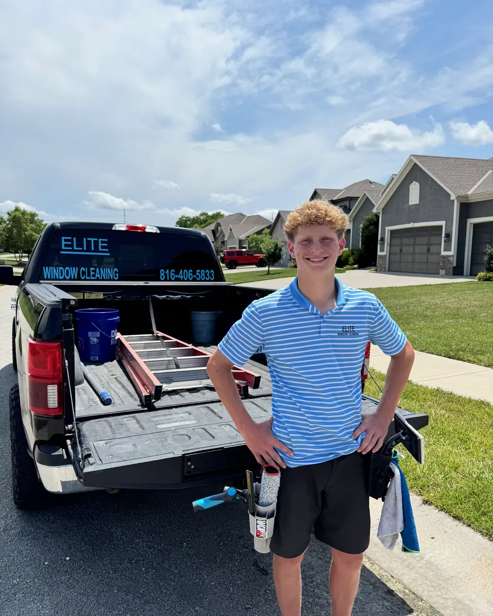 Chandler Zuydendorp, owner of Elite Window Cleaning, standing by his work truck